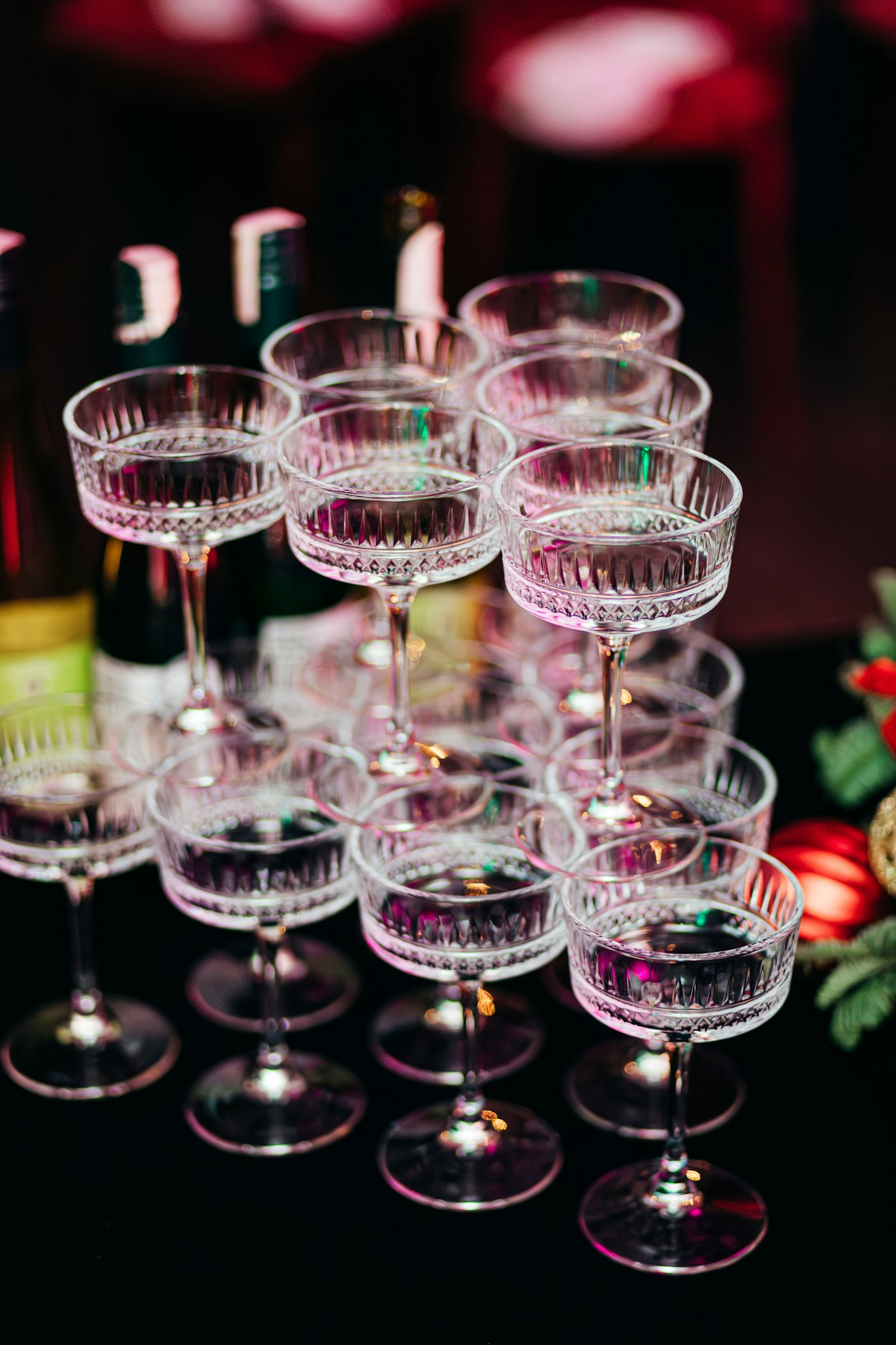 Champagne coupe tower being poured at a celebration
